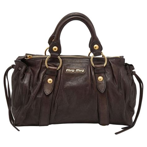 miu miu brown leather grab bag|miumiu clutch bag.